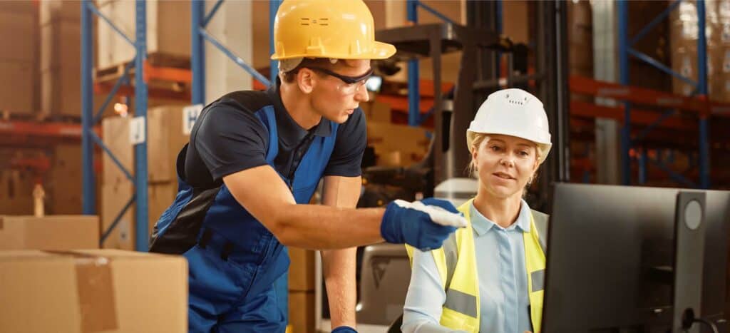 warehouse workers discussion representing demand forecasting constraints