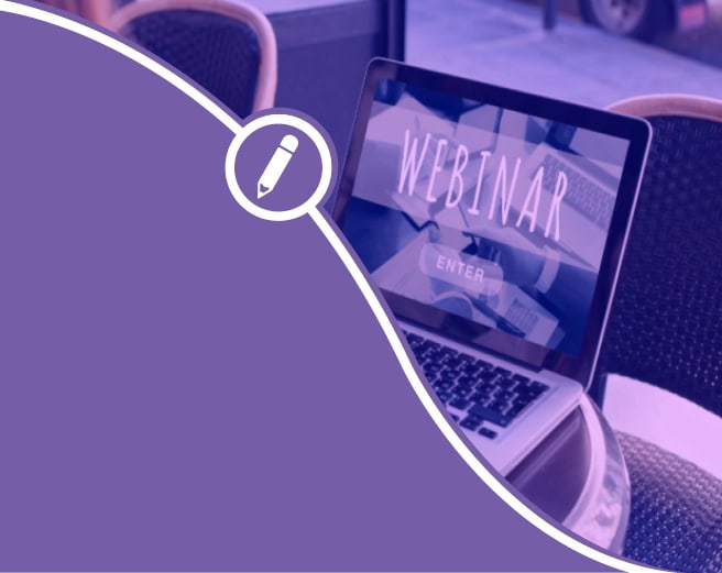 a laptop with the word webinar on the screen