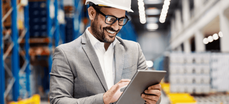 warehouse manager on tablet representing multi-echelon inventory optimization