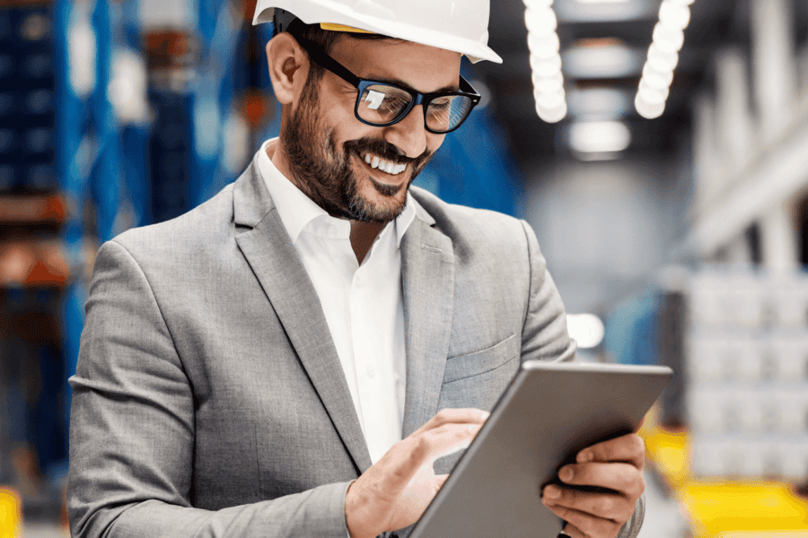 warehouse manager on tablet representing multi-echelon inventory optimization