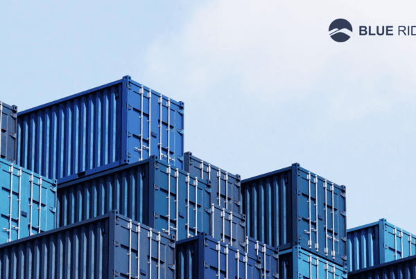 warehouse buildings representing global supply chain risk & uncertainly